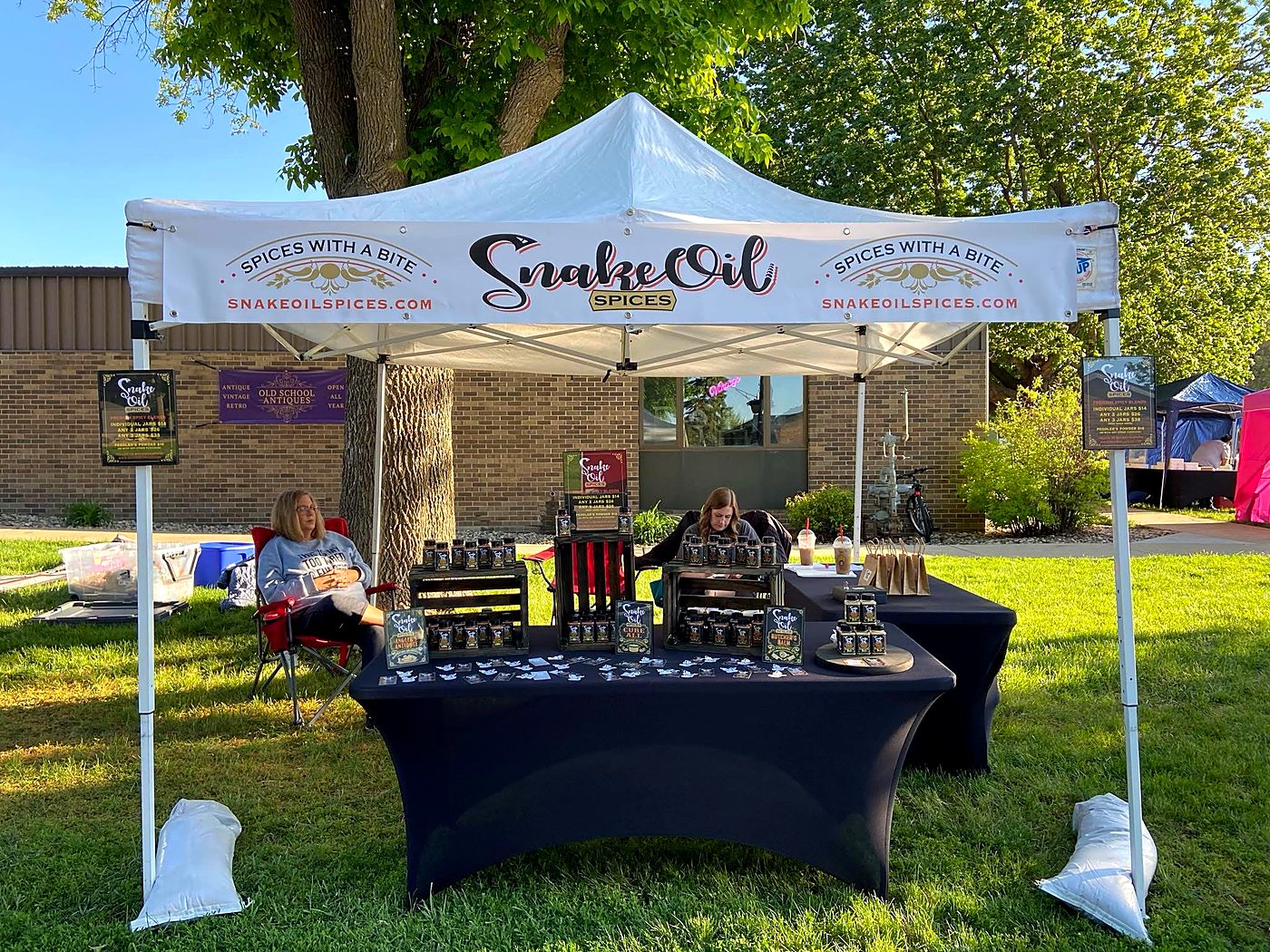 The Snake Oil Spices tent at an outdoor market