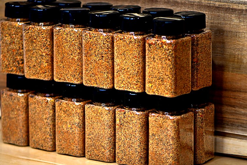 Snake Oil Spices jars stocked on a retail rack