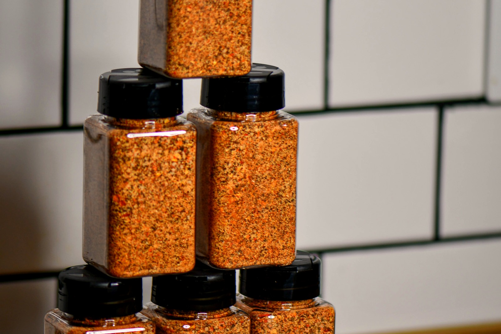 A stack of Snake Oil Spices jars